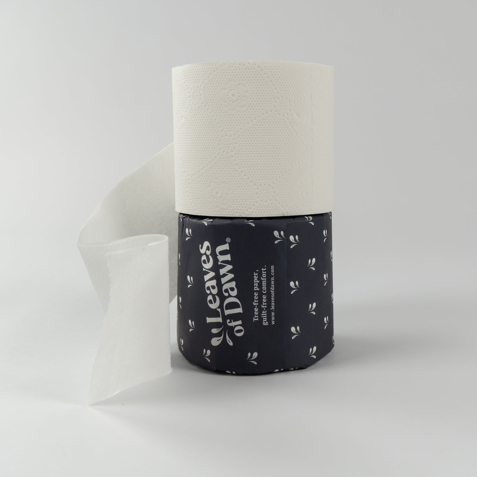 Leaves of Dawn premium 4-ply bamboo toilet paper rolls, packshot, showing their packaging, and soft texture, soft touch.